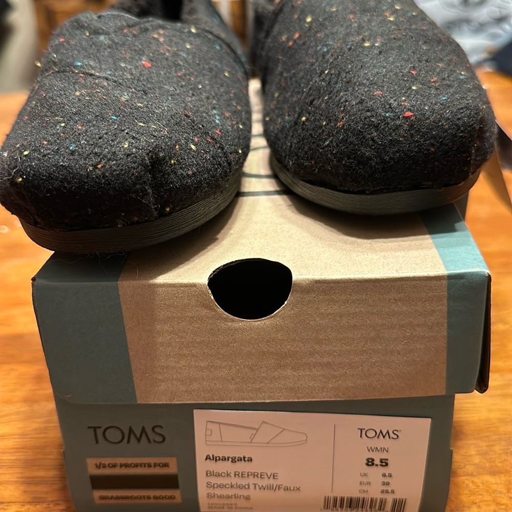 Brand new still in original box from a smoke free home black with multi-colored